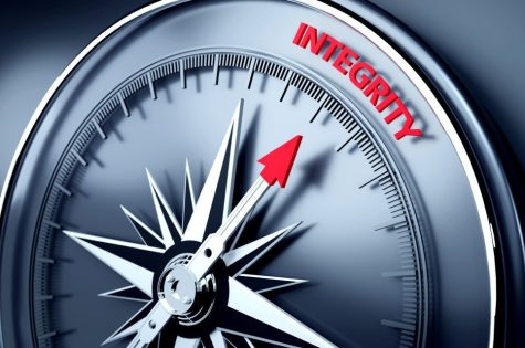 Integrity text is in focus on three dimensional realistic compass's needle. High quality image is ready to crop all your social media sizes with copy space.